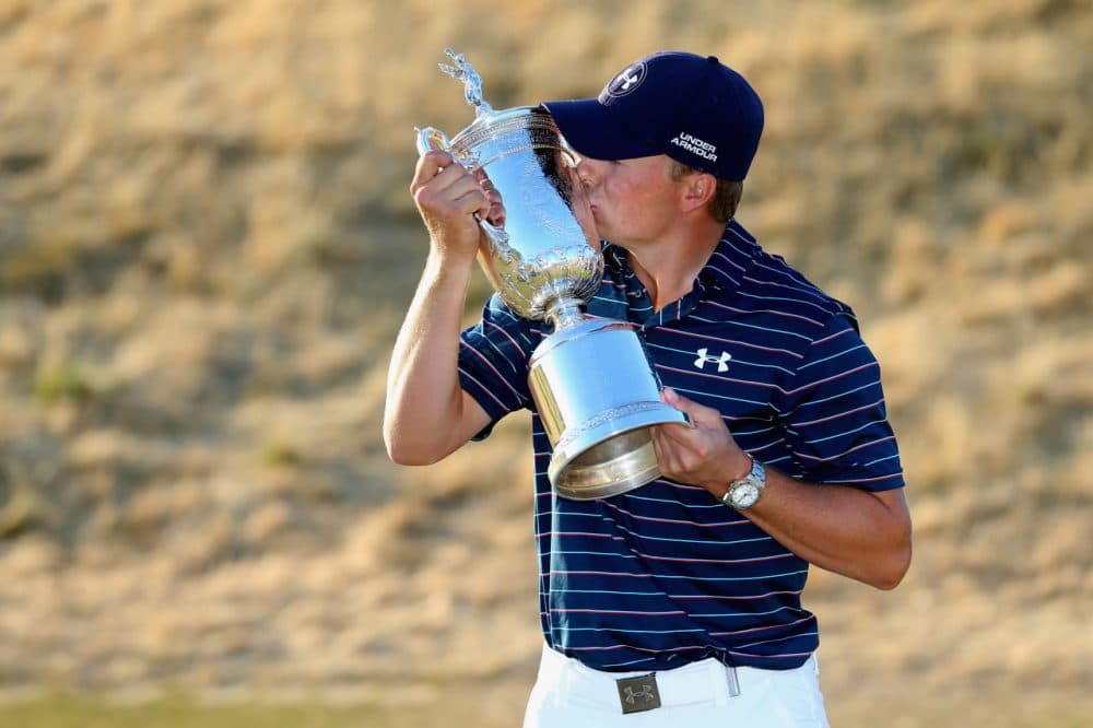 Jordan Spieth kisses the trophy after winning the 115th U.S. Open Championship at Chambers Bay on June 21, 2015 in University Place, Washington.  (Andrew Redington/Getty Images)