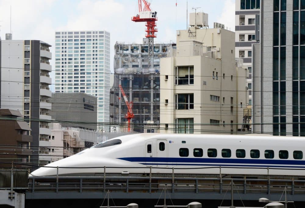 A 'shinkansen' or bullet train speeds past buildings in Tokyo on September 9, 2013. (Toro Yamanaka/AFP/Getty Images)