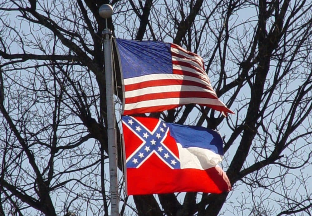 The Mississippi state flag flies under the American flag. (jimmysmith/Flickr)