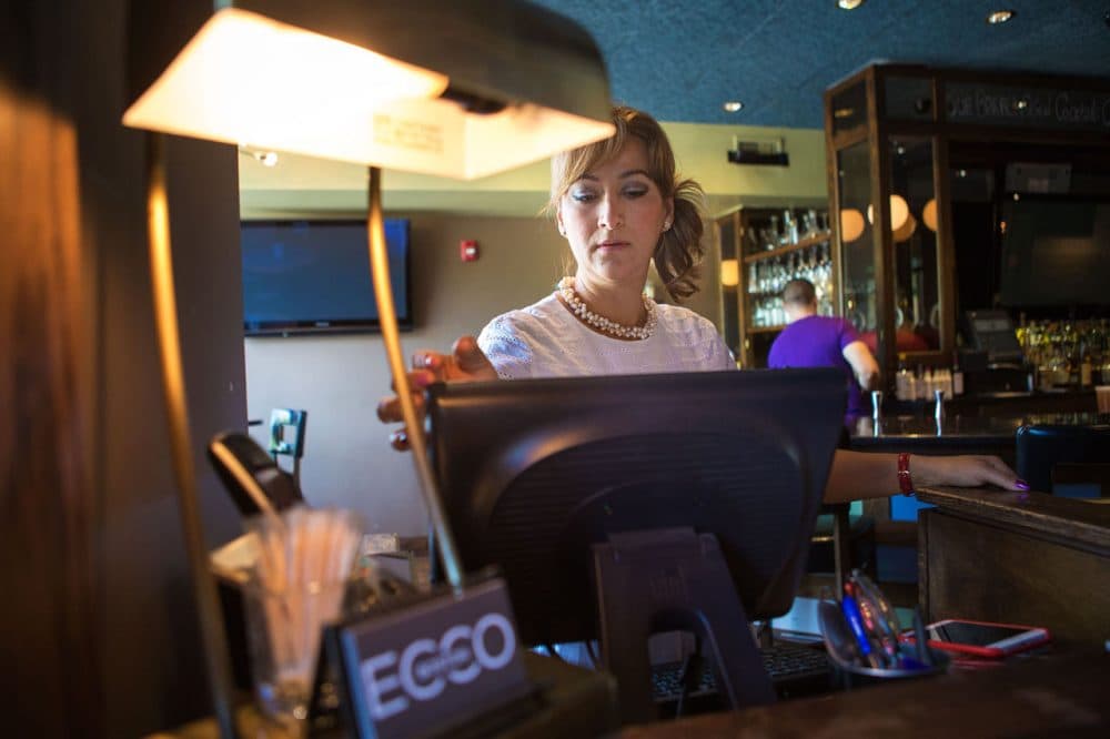 “I am afraid that the character of East Boston is going to be lost,” Diana Morell, a manager at the swanky martini bar Ecco, said of new development in the neighborhood. (Jesse Costa/WBUR)