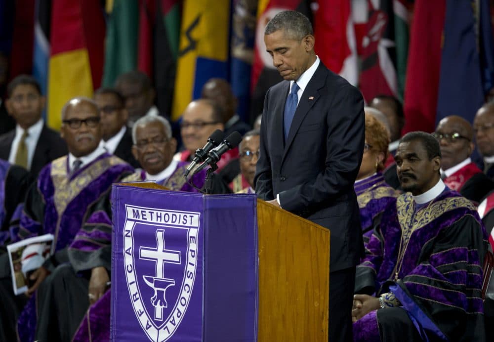 President Barack Obama pauses as he speaks during services honoring the life of Reverend Clementa Pinckney Friday at the College of Charleston TD Arena in Charleston, S.C. (Carolyn Kaster/AP)