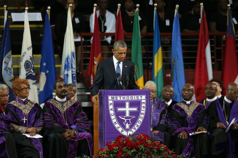 U.S. President Barack Obama delivers the eulogy for South Carolina state senator and Rev. Clementa Pinckney during Pinckney's funeral service June 26, 2015 in Charleston, South Carolina. Suspected shooter Dylann Roof, 21, is accused of killing nine people on June 17th during a prayer meeting in the church, which is one of the nation's oldest black churches in Charleston. (Win McNamee/Getty Images)