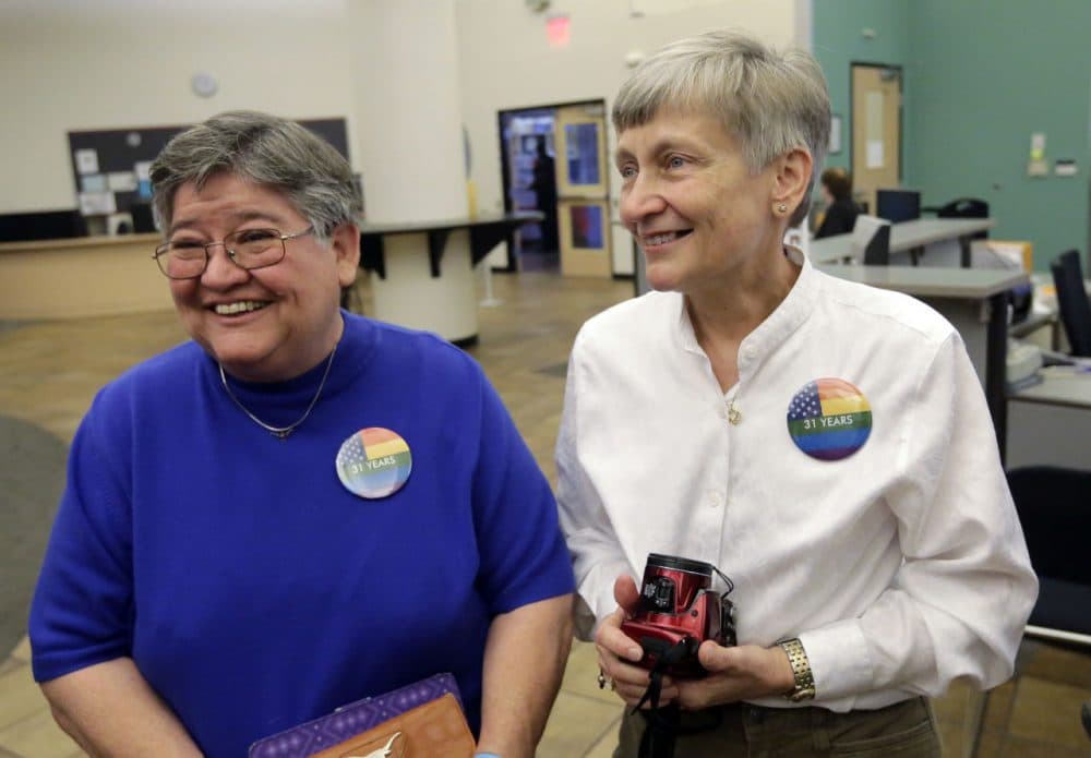 Carmelita Cabello, left, and her partner of 31 years, Jaque Roberts, right, arrive at the Travis County building for a marriage license after hearing the Supreme Court ruling that grants same-sex couples the right to marry nationwide, Friday, June 26, 2015, in Austin, Texas. (Eric Gay/AP)