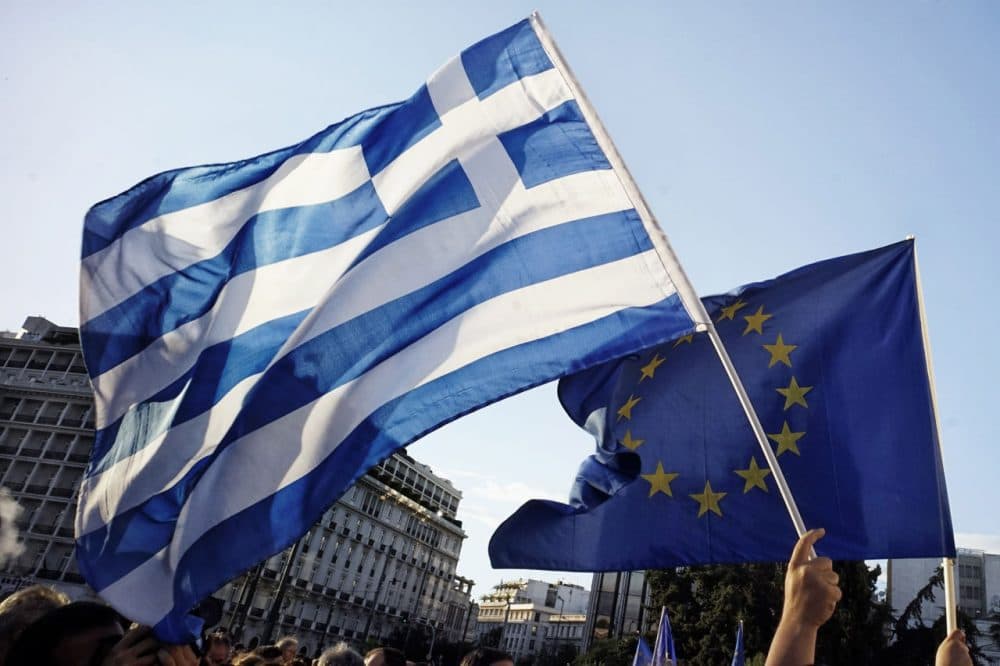 Pro-Euro protesters take part in a rally in front of the Parliament on June 22.  2015 in Athens, Greece. Thousands of people attended the rally in support of Greece remaining in the European Union. Greek banks are closed for six days amid the uncertainty about the bailout deal. (Milos Bicanski/Getty Images)