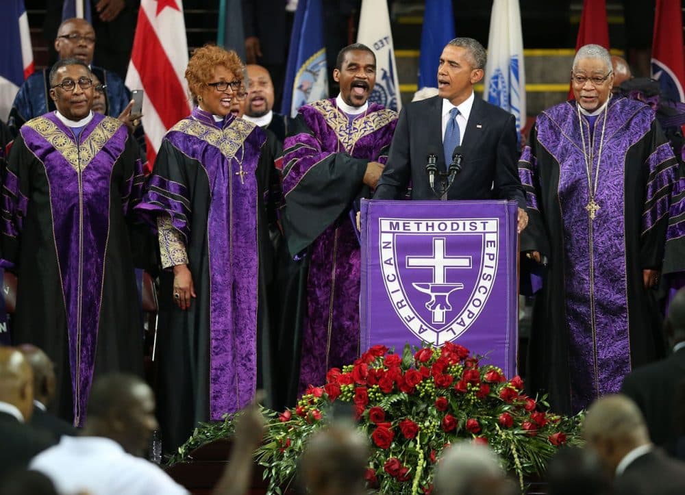 President Barack Obama sings &quot;Amazing Grace&quot; as he delivers the eulogy for South Carolina state senator and Rev. Clementa Pinckney during Pinckney's funeral service June 26, 2015 in Charleston, South Carolina. (Joe Raedle/Getty Images)