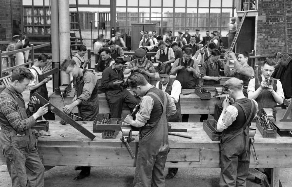 Precision fitters and assemblers at work in the Ministry of Labour Training Centre at Waddon, England on May 19, 1931. Here, in a large factory building, miners from the depressed mining areas all over the country are being trained for entirely new jobs in a scheme which aims to cut unemployment figures. (AP)