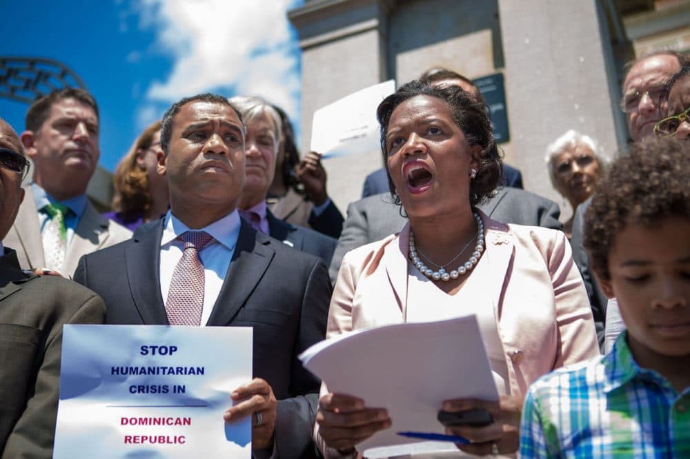 State Sen. Linda Dorcena Forry stands on the steps of the State House Wednesday calling for a boycott of the Dominican Republic to protest that country’s threatened expulsion of Haitians. (Jesse Costa/WBUR)