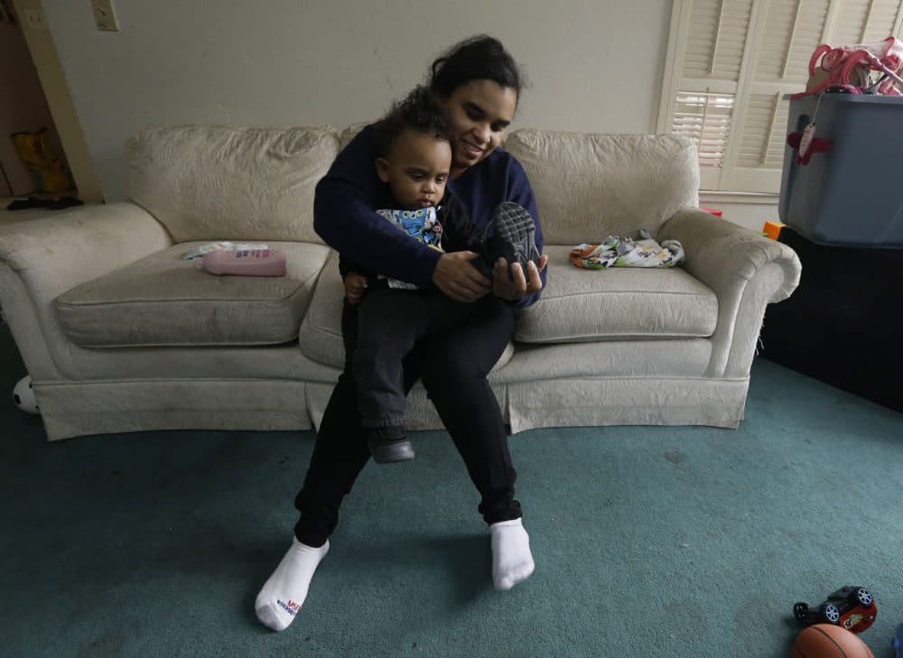 Shannon Henderson, gets her son, Justin, 1, dressed before leaving home for her job as a part-time customer service representative at Wal-Mart in Sacramento, Calif. Henderson is one of an estimated 40 million American workers for who calling in sick is a luxury. If they dont work, they dont get paid. (Rich Pedroncelli/AP)