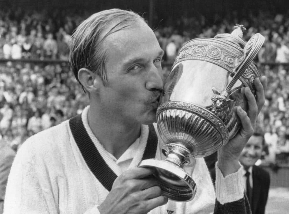 On  July 10, 1972, American tennis champion Stan Smith kisses the cup after beating Romania's Ilie Nastase to win the men's singles title at Wimbledon, London.  (Roger Jackson/Getty Images)