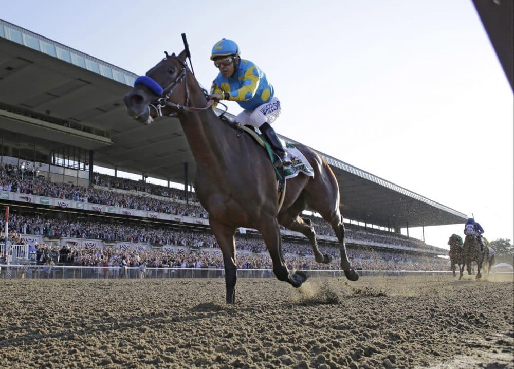 Victor Espinoza reacts after crossing the finish line with American Pharoah to win the 147th running of the Belmont Stakes horse race at Belmont Park, Saturday, June 6, 2015, in Elmont, N.Y. American Pharoah is the first horse to win the Triple Crown since Affirmed won it in 1978.  (AP Photo/Julio Cortez)