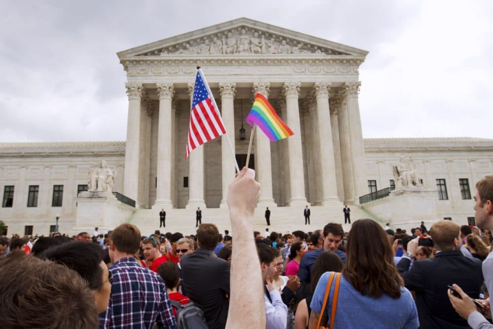 A crowd celebrates outside of the U.S. Supreme Court Friday after the court declared that same-sex couples have a right to marry anywhere in the U.S. (Jacquelyn Martin/AP)
