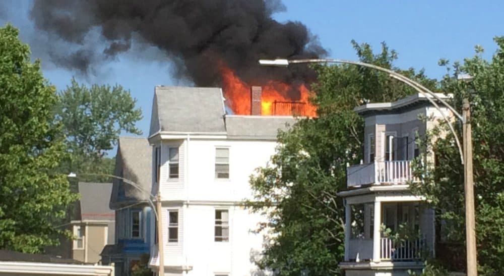 A house is on fire. Do you rush to warn residents who might still be inside, or do you stop to take a picture? (Judith Harris/Courtesy)