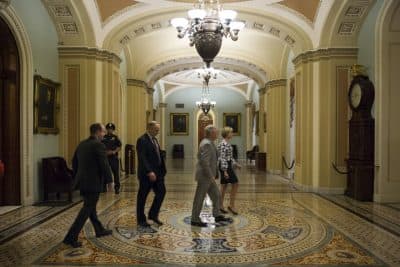 Senate Majority Leader Mitch McConnell, R-Ky., leaves the Senate Chamber after offering amendments to the USA FREEDOM Act during a special session to extend surveillance programs, in Washington, Sunday, May 31, 2015. 