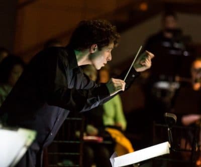 Composer Matthew Aucoin conducting at Peabody Essex Museum. (John Andrews/Peabody Essex Museum)