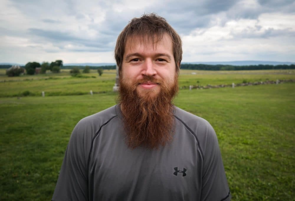 Kyle Beger, 28, of St. Joseph, Missouri, visits The Angle at the Gettysburg battlefield, June 17, 2015. The site marks the place where Confederate soldiers briefly broke the Union line during Pickett's Charge on the third day of the battle. (Lou Blouin)