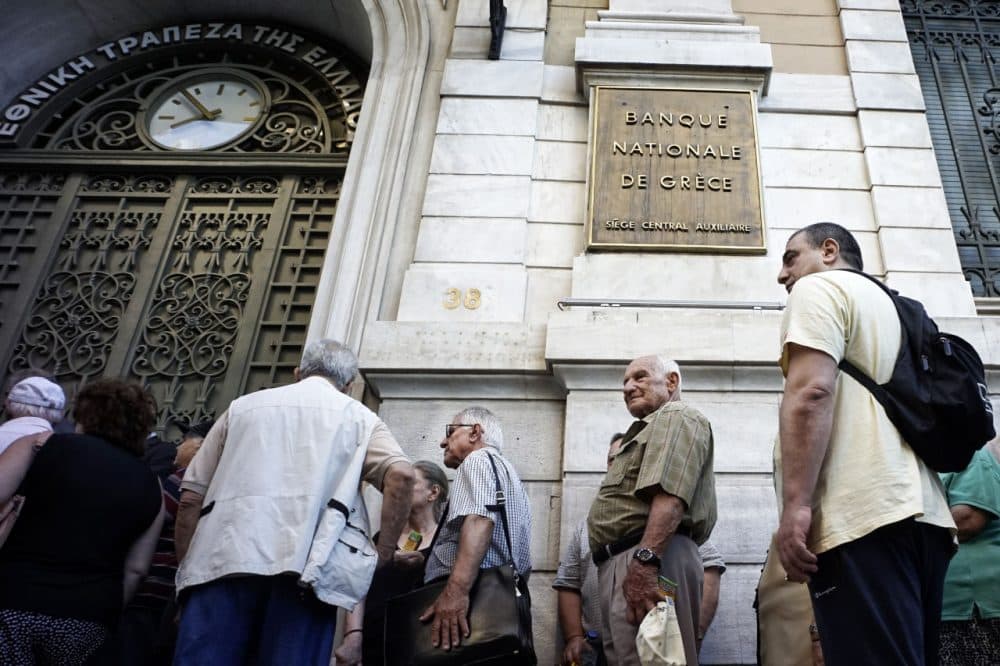 Pensioners line up outside a National Bank branch on July 2, 2015 in Athens, Greece. As people continue to queue outside banks Greek finance minister Yanis Varoufakis said that he will quit if voters don't back him up in Sunday's referendum. (Milos Bicanski/Getty Images)