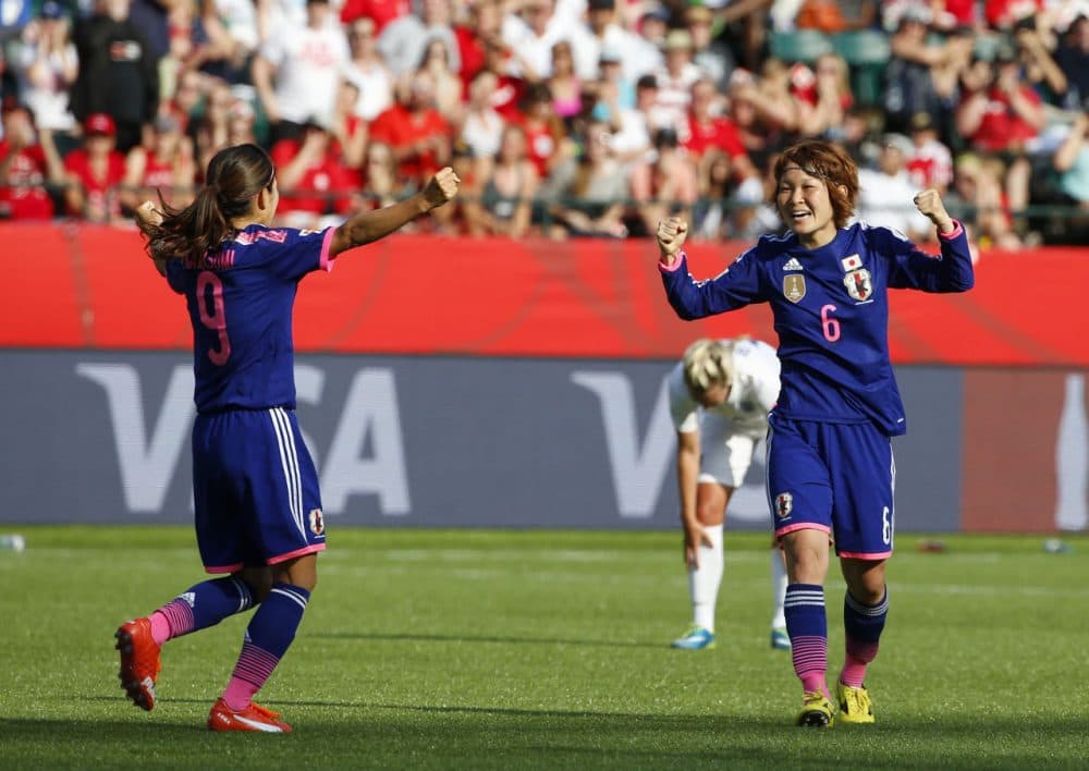 Nahomi Kawasumi #9 and Mizuho Sakaguchi #6 of Japan celebrate after Laura Bassett #6 of England scored on her own team in the final minutes of the game during the FIFA Women's World Cup Canada Semi Final match between England and Japan at Commonwealth Stadium on July 1, 2015 in Edmonton, Alberta, Canada. (Todd Korol/Getty Images)