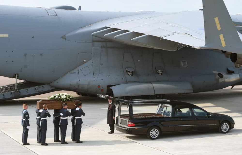 The coffin of Elaine Thwaites, one of the victims of last Friday's terrorist attack, is taken from the RAF C-17 aircraft at RAF Brize Norton in Tunisia, on July 1, 2015 in Brize Norton, England. (Joe Giddens/WPA Pool/Getty Images)