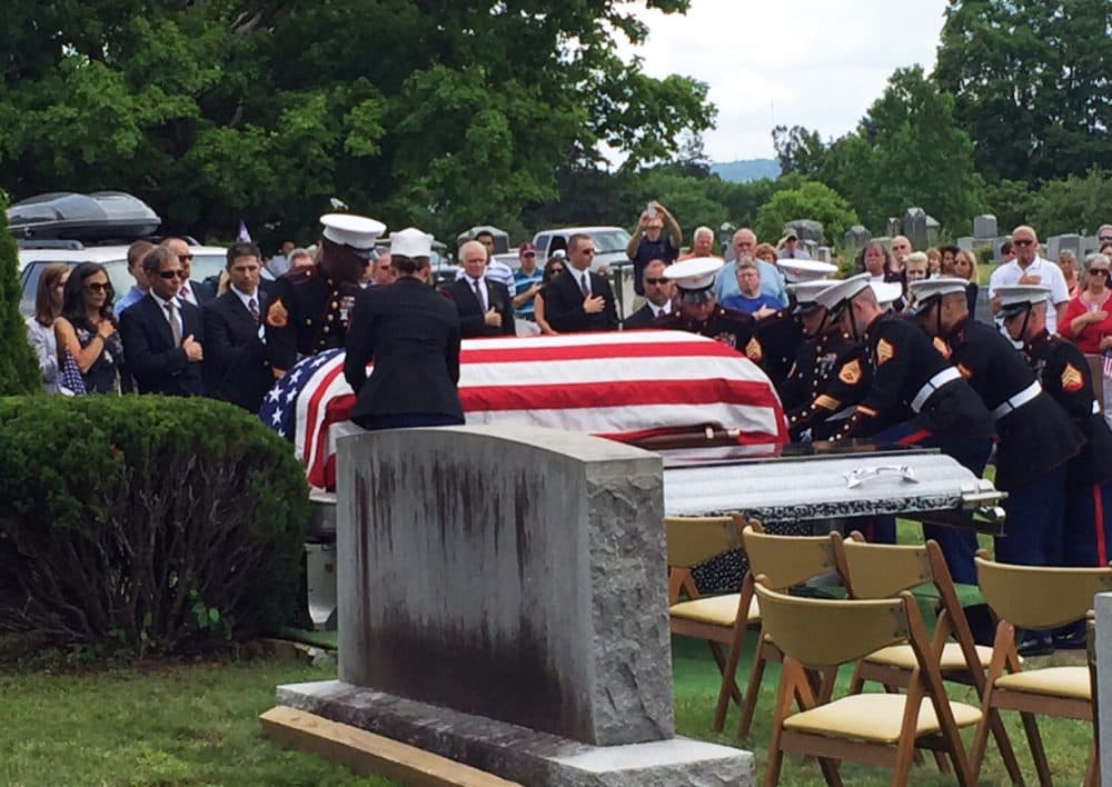 Family and servicemen gather at the burial service for a World War II Marine in his hometown. (David Boeri/WBUR)