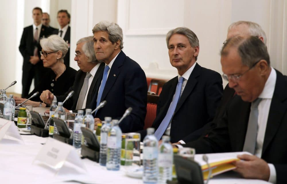US Secretary of State John Kerry, British Foreign Secretary Philip Hammond (C) and Russian Foreign Minister Sergey Lavrov (R) sit around the table at the Palais Coburg Hotel where the Iran nuclear talks meetings are being held in Vienna, Austria on July 6, 2015. (Carlos Barria/Getty Images)