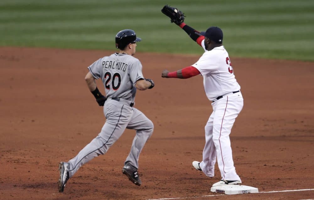 Boston Red Sox first baseman David Ortiz makes the force on Miami Marlins J.T. Realmuto during a game at Fenway Park in Boston, Wednesday July 8, 2015. (Charles Krupa/AP)