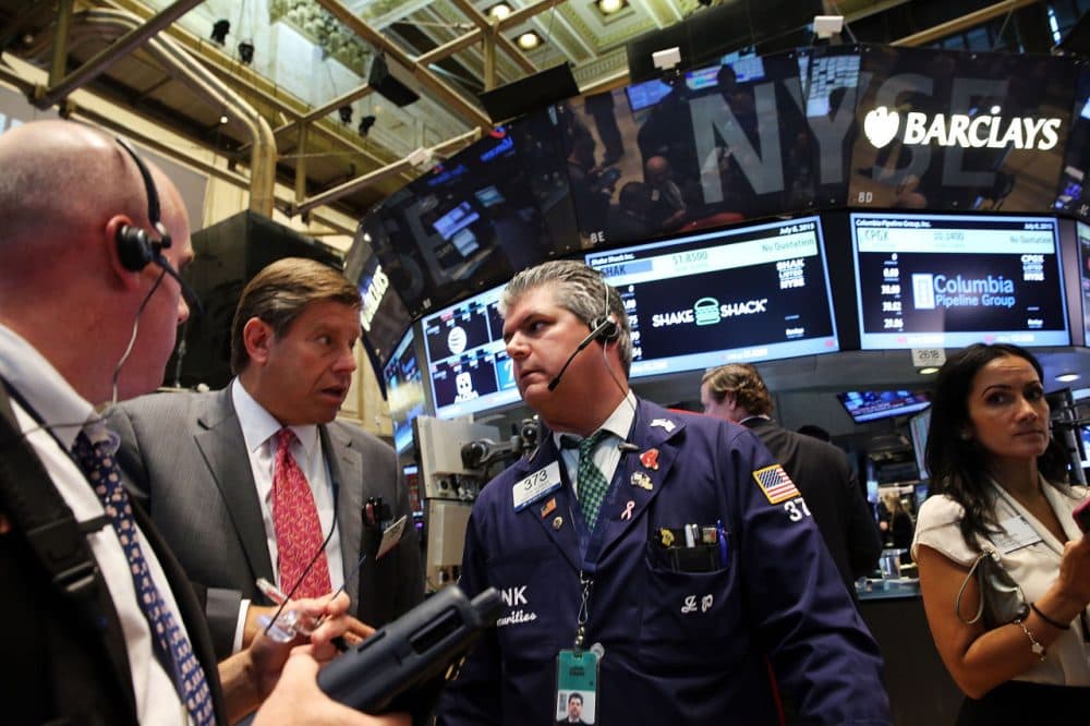 Traders wait for trading to resume on the floor of the New York Stock Exchange (NYSE) after trading was halted due to a &quot;technical glitch&quot; on July 8, 2015 in New York City. Trading was to resume in the afternoon. (Spencer Platt/Getty Images)