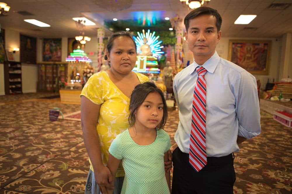 Lowell fire survivors Kim Soeun, left, and her daughter, and Virk Uy, of the Cambodian Mutual Assistance Association. (Jesse Costa/WBUR)
