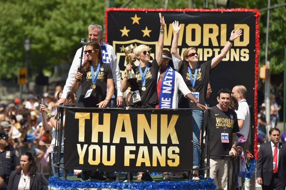 Soccer players Carli Lloyd and Megan Rapinoe in the New York City Ticker Tape Parade for World Cup Champions U.S. Women's Soccer National Team on July 10, 2015 in New York City. (Michael Loccisano/Getty Images)
