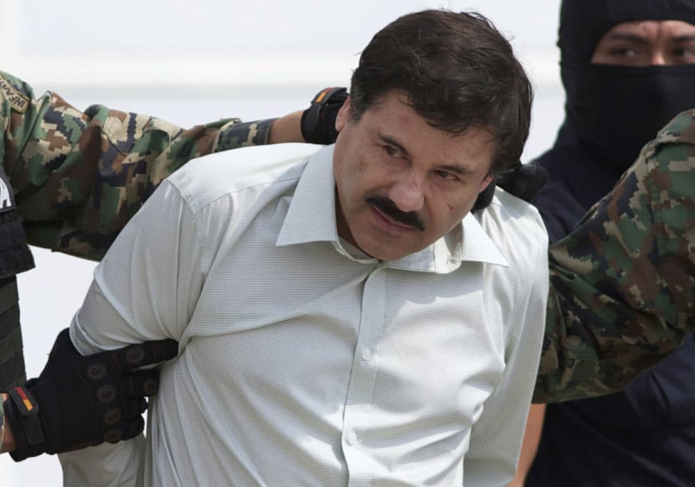 In this 2014 file photo, Joaquin &quot;El Chapo&quot; Guzman, head of Mexico’s Sinaloa Cartel, is escorted to a helicopter in Mexico City, following his capture in the beach resort town of Mazatlan in February that year. (Eduardo Verdugo/AP)