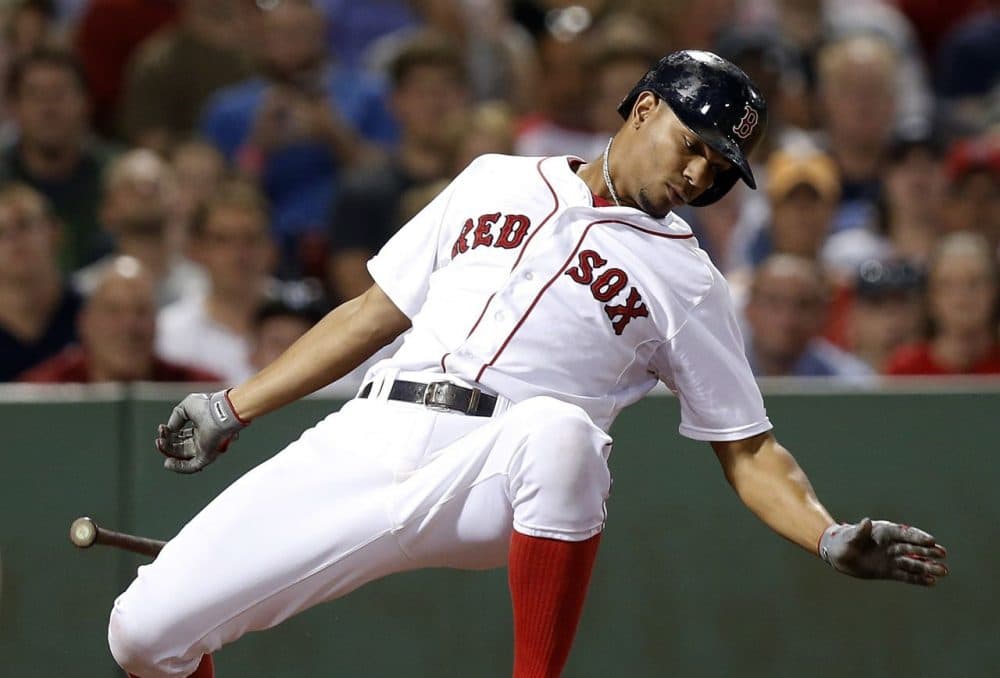 Boston Red Sox's Xander Bogaerts dodges an inside pitch during the seventh inning.  (AP Photo/Michael Dwyer)