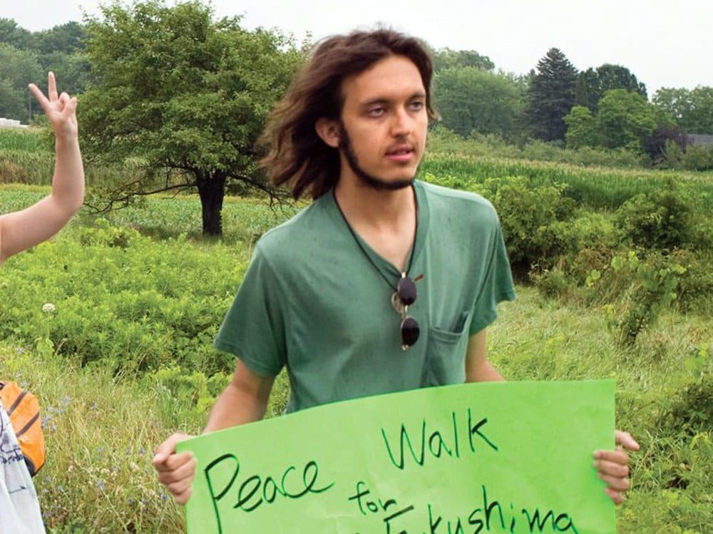 In this 2012 photo provided by the Northumberland News, Alexander Ciccolo participates in a peace walk through Brighton, Ontario. Law enforcement officials say Ciccolo was arrested after his father, a Boston police captain, alerted authorities that his son was talking about joining the Islamic State group and setting off bombs. (Dave Fraser/Northumberland News via AP)