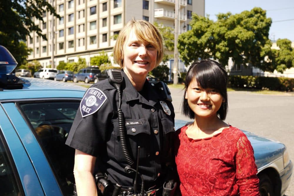Officer Michelle Vallor and community leader Vung It. (Liz Jones/KUOW)