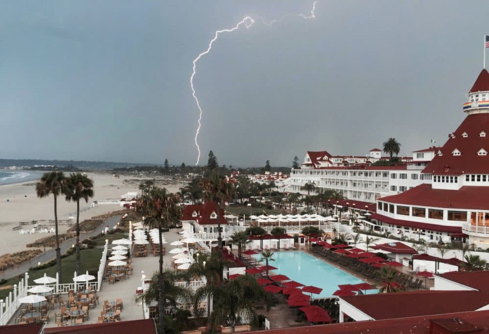 In this Saturday, July 18, 2015, photo provided by Brook Taylor, a lightning storm is captured from the Hotel Del Coronado in San Diego, Calif. A second day of showers and thunderstorms in southern and central California on Sunday was expected to bring heavy rain and set more rainfall records in what is usually a dry month. (Brook Taylor via AP)