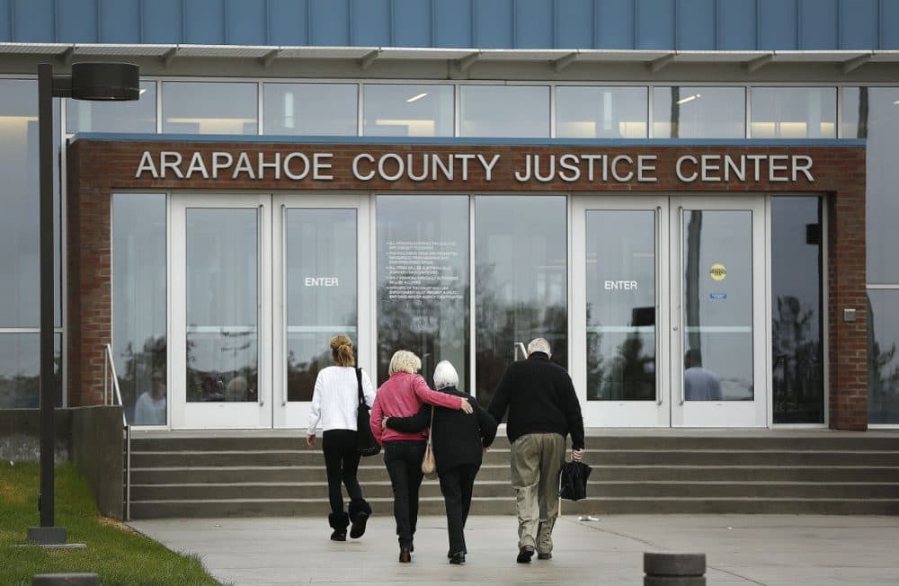 Family members of Aurora Theater shooting victim Veronica Moser walk into the Arapahoe County Justice Center as opening arguments for the trial of Aurora Theater Shooting defendant James Holmes opened at the courthouse April 27, 2015 in Centennial, Colorado. (Photo by Marc Piscotty/Getty Images)