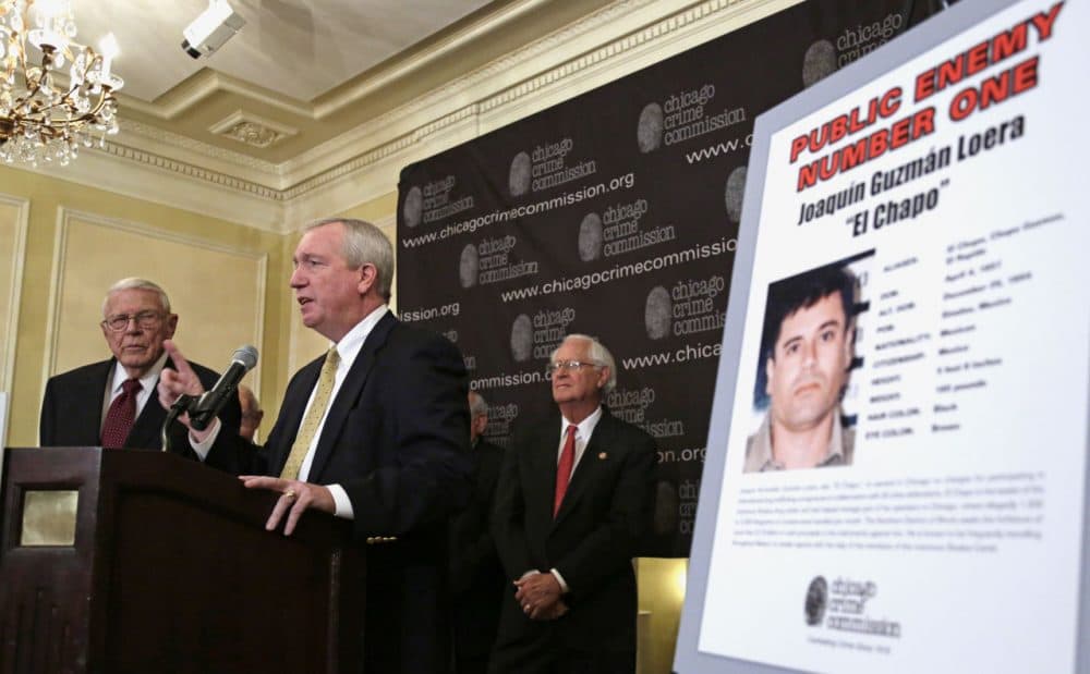 In this Feb. 14, 2013 photo, Jack Riley, Special Agent In Charge for the DEA, Chicago Field office (center) announces that Joaquin &quot;El Chapo'' Guzman, a drug kingpin in Mexico, is Chicago's Public Enemy No. 1, during a news conference in Chicago. Now that Guzman has escaped a prison in Mexico, he’s regaining his infamous title. (M. Spencer Green/AP)