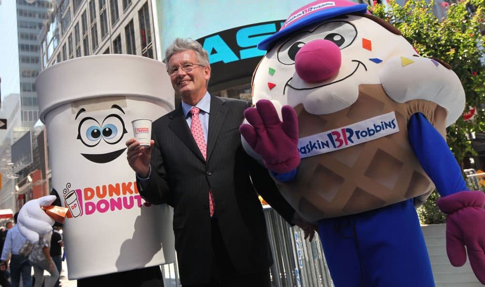 Dunkin' Brands Group President and CEO Nigel Travis, the parent company of Dunkin' Donuts and Baskin-Robbins, celebrates their initial public offering outside the NASDAQ MarketSite on July 27, 2011 in New York City.(Mario Tama/Getty Images)