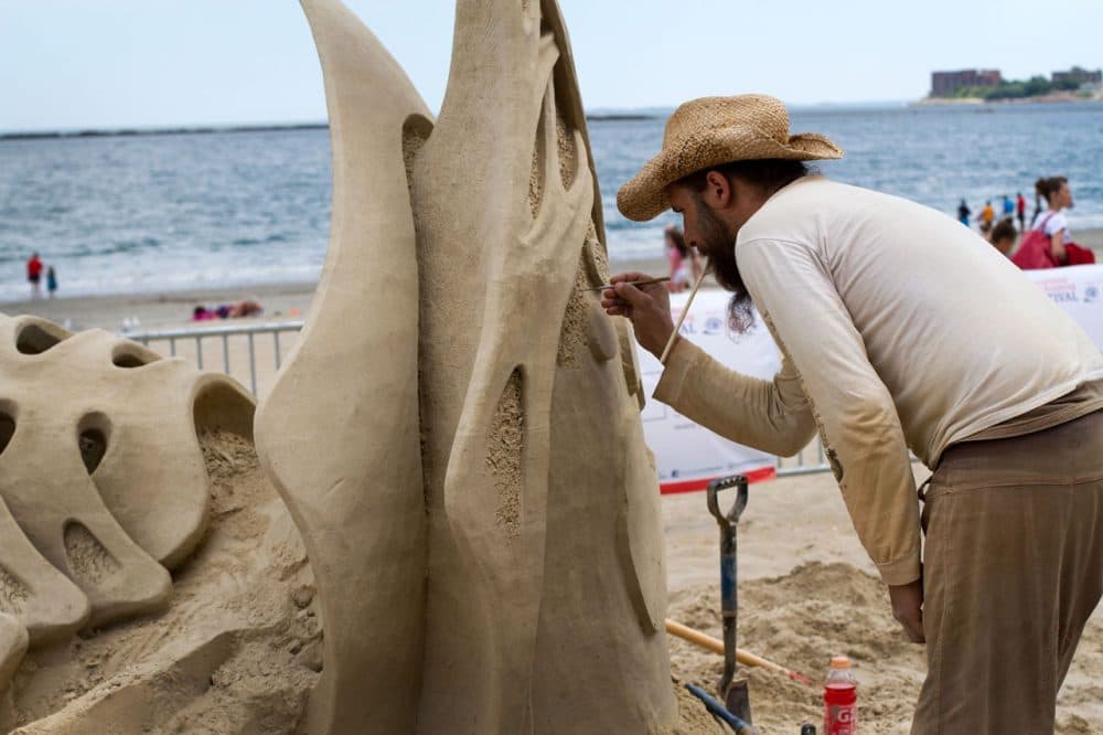 Jonathan Bouchard of Canada, who has placed first in this contest three out of the last four years, works on his sculpture. (Hadley Green for WBUR). 