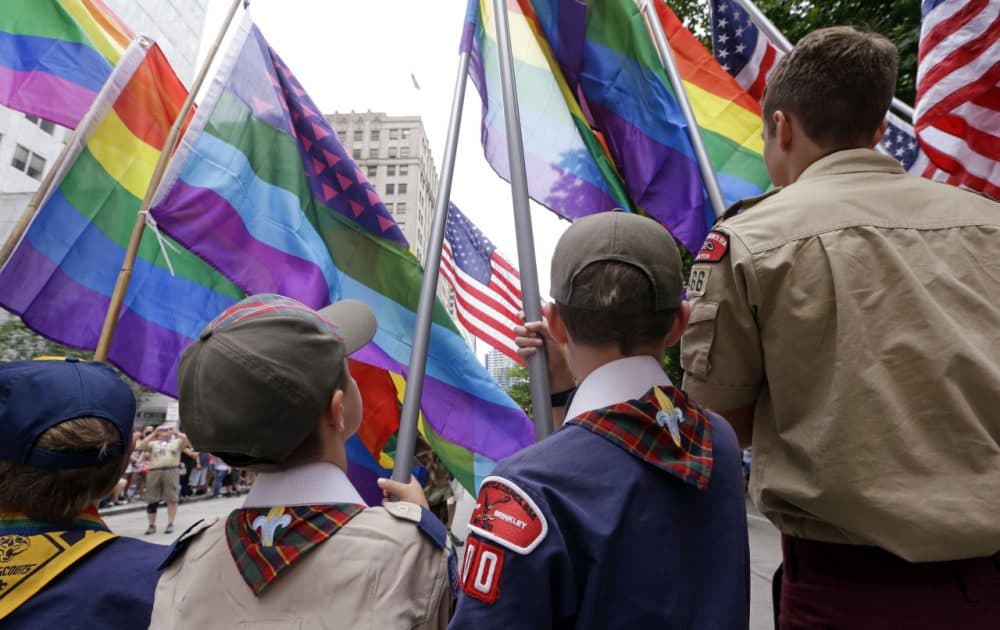 Cub Scouts and Boy Scouts prepare to lead marchers while waving flags at the 41st annual Pride Parade Sunday, June 28, 2015, in Seattle. (Elaine Thompson/AP)