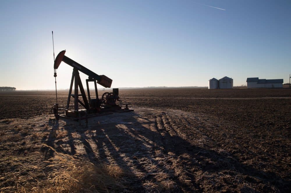 An idled pump jack, once used to extract crude oil from the ground, sits above a well on the edge of a farmers field on January 21, 2015 near Ridgway, Illinois. With oil prices near a 5 1/2-year low, oil companies are beginning to slow drilling operations in the United States.  (Scott Olson/Getty Images)