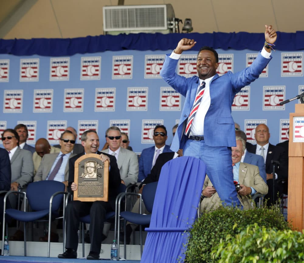 National Baseball Hall of Fame inductee Pedro Martinez dances as he is introduced  during an induction ceremony at the Clark Sports Center on Sunday in Cooperstown, N.Y. (Mike Groll/AP)