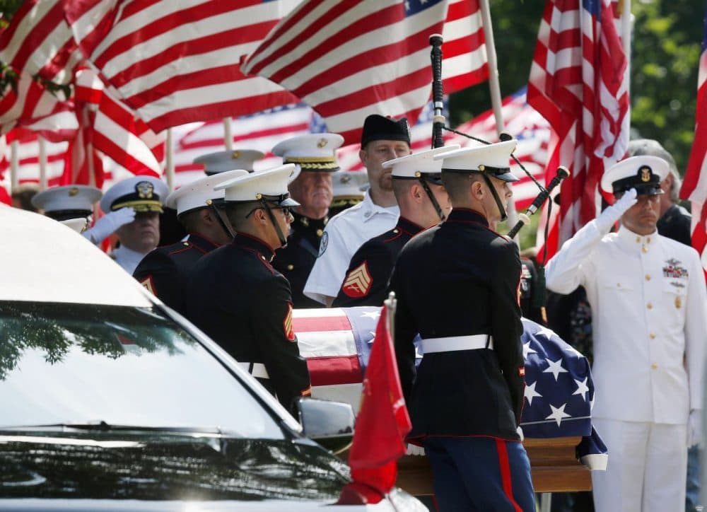 Marine pallbearers carry the casket of Marine Gunnery Sgt. Thomas Sullivan, who died in the July 16 Chattanooga shooting, into a funeral service in Springfield, Mass., on  July 27, 2015. (Michael Dwyer/AP)