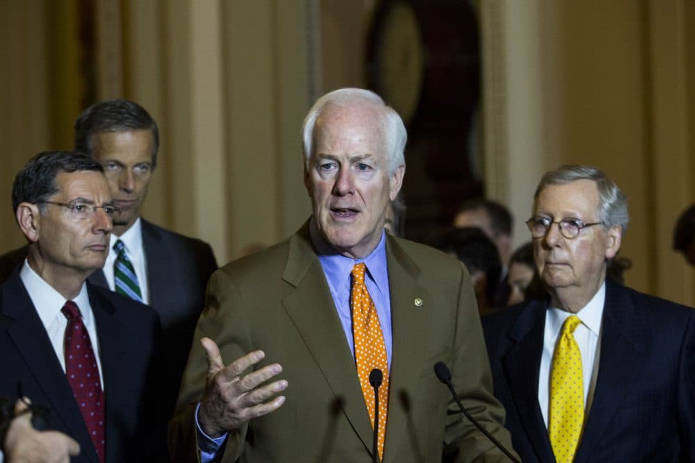 From left, Sen. John Barrasso (R-WY),  Sen. John Thune (R-SD), Sen. John Cornyn (R-TX) and Senate Majority Leader Mitch McConnell (R-KY) take questions during a news conference after a meeting with Senate Republicans, on Capitol Hill, July 28, 2015 in Washington, DC.  On Tuesday, the Senate is continuing to work toward passing a long-term extension of a federal highway bill that is set to expire on Friday. (Drew Angerer/Getty Images)