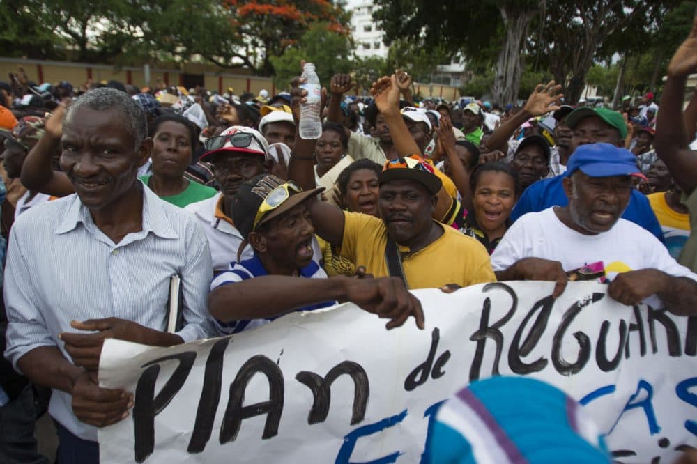 Haitian sugar cane workers march to the National Palace in Santo Domingo to protest about the deadline to enter the National Plan of Regularization of Foreigners in Dominican Republic, on June 17, 2015. (Erika Santelices/AFP/Getty Images)