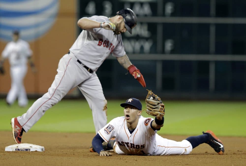 Houston Astros shortstop Carlos Correa can't believe Red Sox's Mike Napoli is safe at second base. (Pat Sullivan/AP)