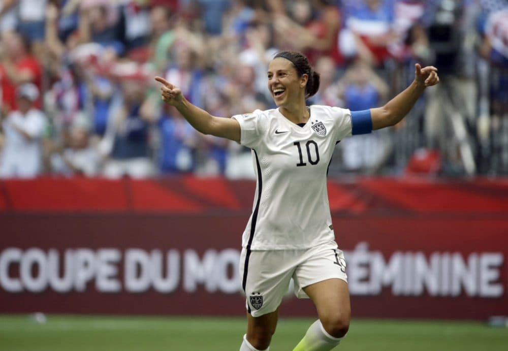 United States' Carli Lloyd celebrates after scoring her third goal against Japan during the first half of the FIFA Women's World Cup soccer championship in Vancouver, British Columbia, Canada, Sunday, July 5, 2015. (AP Photo/Elaine Thompson)