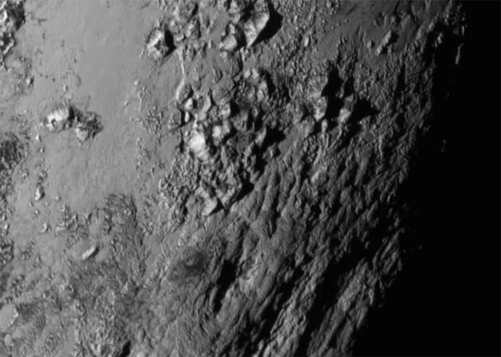 This NASA image shows a region near Pluto's equator with a range of mountains captured by the New Horizons spacecraft. (NASA via AP)