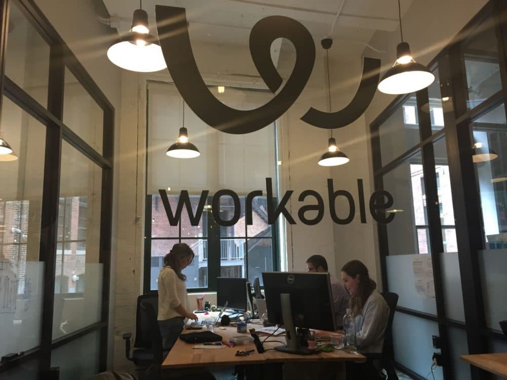 At the South Boston office of Workable, employees keep one eye on events in Greece. (Curt Nickisch/WBUR) 
