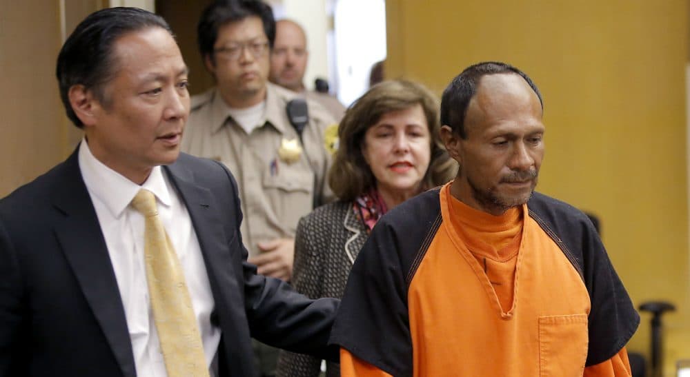 Juan Francisco Lopez-Sanchez, right, is led into the courtroom on Tuesday, July 7, 2015, for his arraignment at the Hall of Justice in San Francisco for the killing of a 32-year old San Francisco woman. Lopez-Sanchez was released from jail in April, even though immigration officials had lodged a detainer to try to deport him from the country for a sixth time. (Michael Macor/San Francisco Chronicle/AP)
