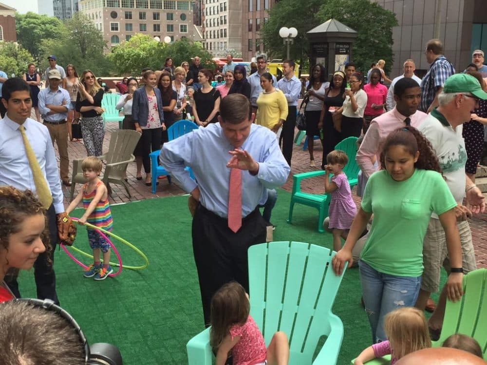 Boston Mayor Marty Walsh greets guests Wednesday afternoon during a launch party for the city's new &quot;front lawn&quot; on City Hall Plaza. (Jack Lepiarz/WBUR)