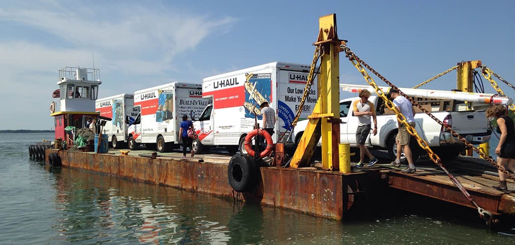 U-Haul box trucks loaded with art were barged out to Georges Island last week for the Isles Arts Initiative. (Amy Archambault)